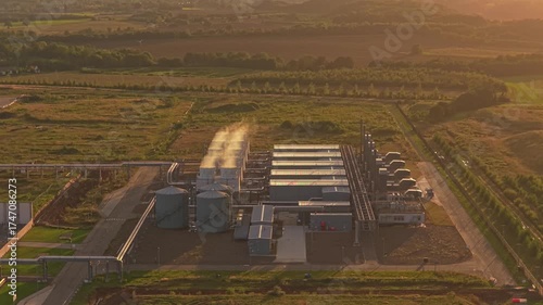 Google data hub at dusk, drone aerial shot in warm sunset light