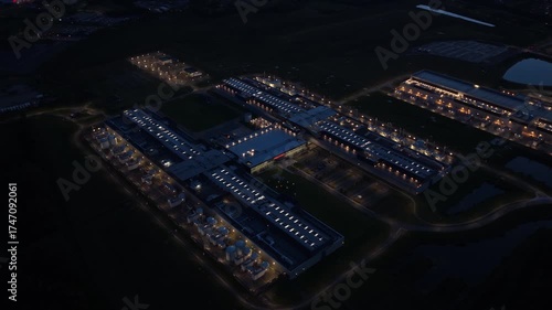 Cloud computing and AI data center glowing under night sky.