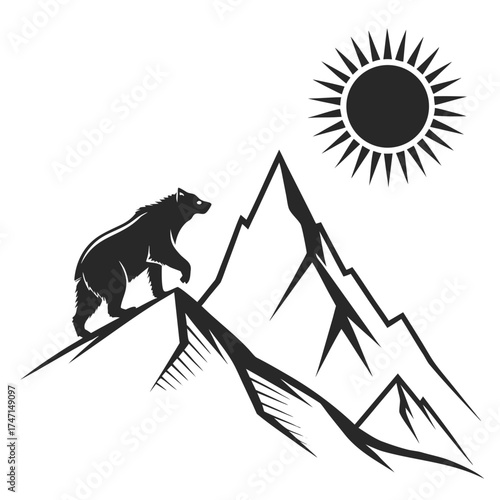 Black bear on mountain peak with rising sun silhouette