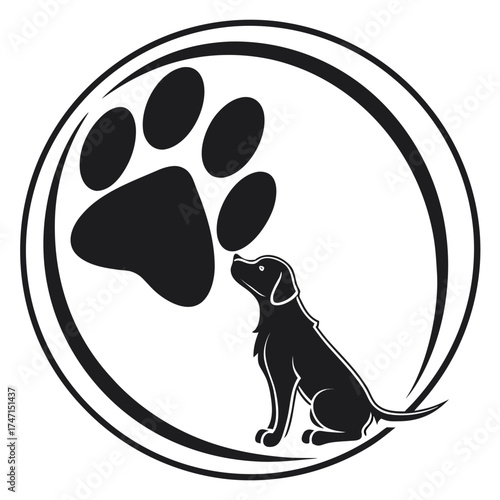 Black dog looking up at paw print inside circle logo