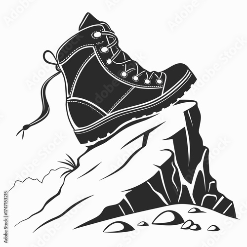 Black hiking boot on a rocky cliff edge shoe footwear