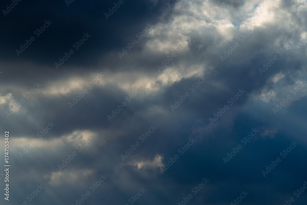 Fototapeta premium Sun Rays Breaking Through Storm Clouds