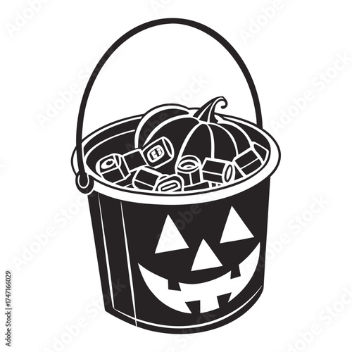 Black and white pumpkin bucket filled with candy halloween