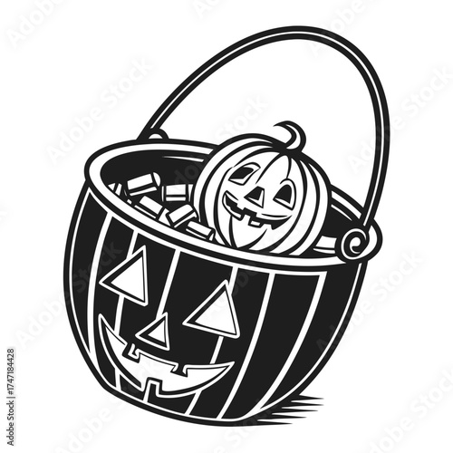 Black and white pumpkin bucket overflowing with candy