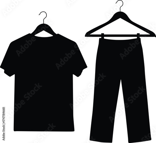 Black silhouette of a t shirt and pants hanging on hangers isolated on white background