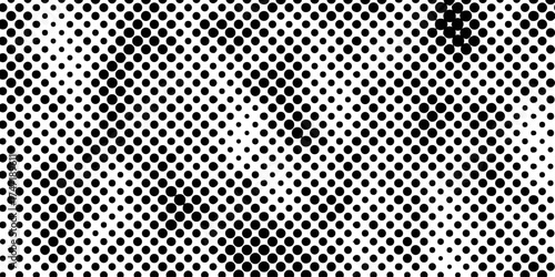 Abstract halftone pattern black dotted white background varying sized of black circles, dotted halftone gradient seamless pop art modern background of monochrome overlay design element.