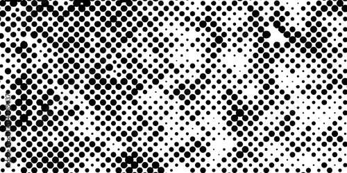 Abstract halftone pattern black dotted white background varying sized of black circles, dotted halftone gradient seamless pop art modern background of monochrome overlay design element.
