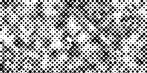 Abstract halftone pattern black dotted white background varying sized of black circles, dotted halftone gradient seamless pop art modern background of monochrome overlay design element.