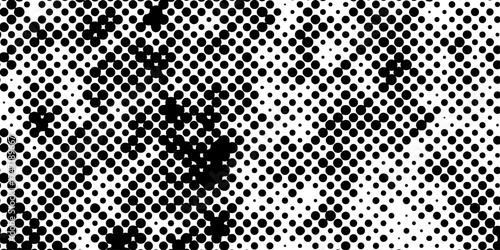 Abstract halftone pattern black dotted white background varying sized of black circles, dotted halftone gradient seamless pop art modern background of monochrome overlay design element.