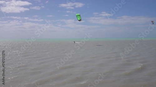 Kitesurfer Jumping Over Ocean Waves at Sunset in the Florida Keys