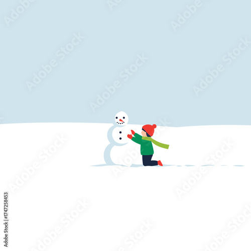 Child playing and building snowman in winter snowy landscape  