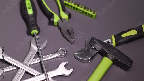 A set of building tools and instruments for repair in black and green colour. Must-have for men. Equipment for building. Repair tool kit. construction concept. gray background . High quality photo