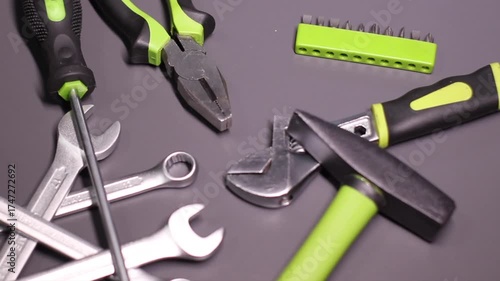 A set of building tools and instruments for repair in black and green colour. Must-have for men. Equipment for building. Repair tool kit. construction concept. gray background . High quality photo