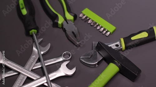 A set of building tools and instruments for repair in black and green colour. Must-have for men. Equipment for building. Repair tool kit. construction concept. gray background . High quality photo