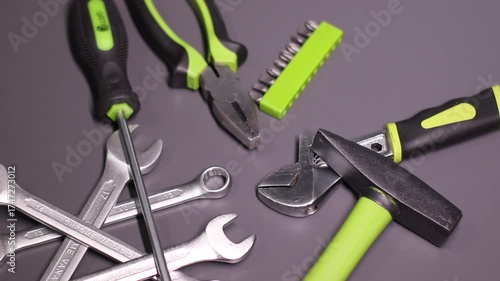 A set of building tools and instruments for repair in black and green colour. Must-have for men. Equipment for building. Repair tool kit. construction concept. gray background . High quality photo