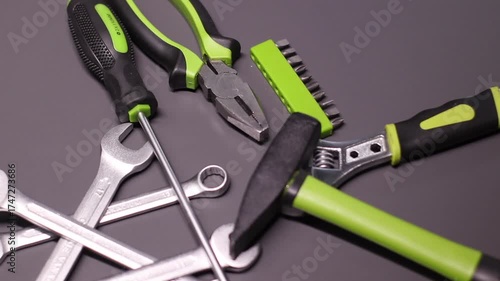 A set of building tools and instruments for repair in black and green colour. Must-have for men. Equipment for building. Repair tool kit. construction concept. gray background . High quality photo