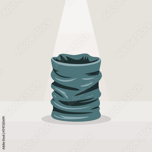 A textured piece of fabric is illuminated in spotlight, showcasing its unique folds and design. This image represents creativity in textiles and fashion in an artistic manner.