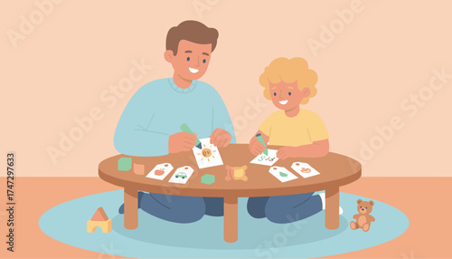 Happy father and son bonding while learning with educational flashcards at home