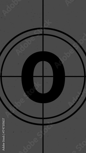 Old film countdown animation classic look. Timer running from five to zero seconds with dust overlay and scratch marks. Vertical motion graphic.