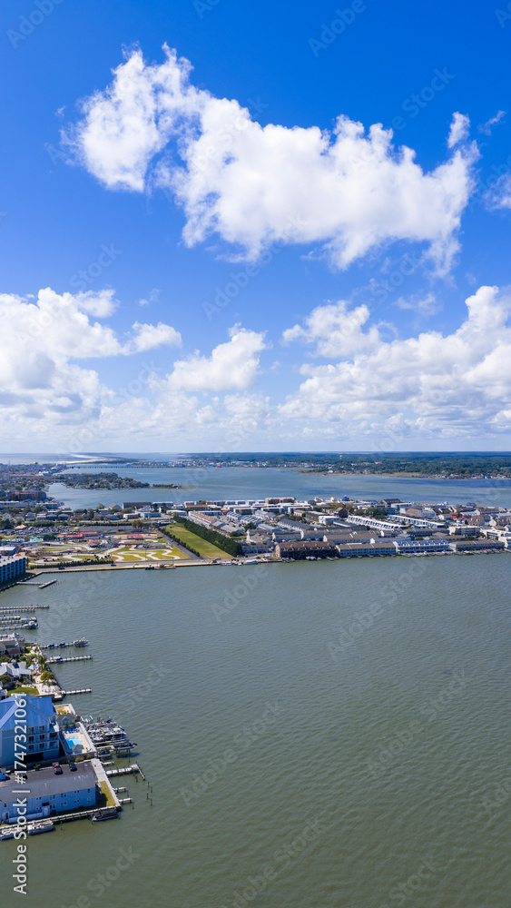 Fototapeta premium Aerial shot of hotels and condos and blue ocean water in Ocean City Maryland USA