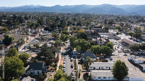 Tree lined view of a neighborhood near downtown Corona, California, USA.