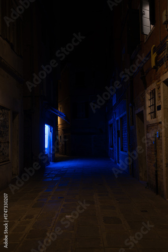 Dark Venice Alleyway with Blue Light at Night