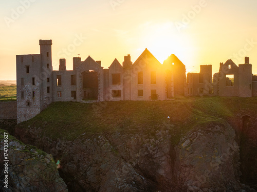 Wallpaper Mural Slains Castle with sunburst of setting sun. Torontodigital.ca