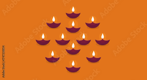 Eleven lit diyas are symmetrically arranged on a solid orange background