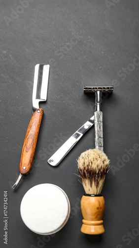 Vintage shaving tools on a dark surface