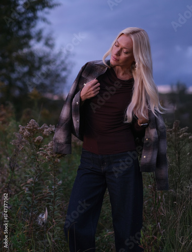 Golden Hour Serenity – Woman Enjoying a Warm Autumn Evening
