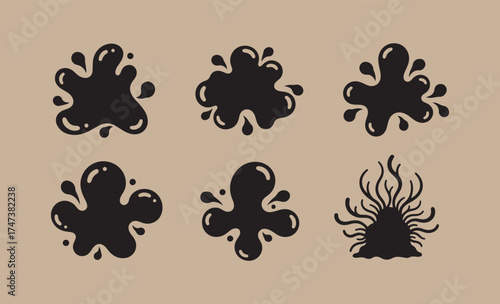 Collection of black ink splatter and blob shapes