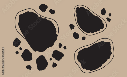 Abstract black shapes with outline on tan background