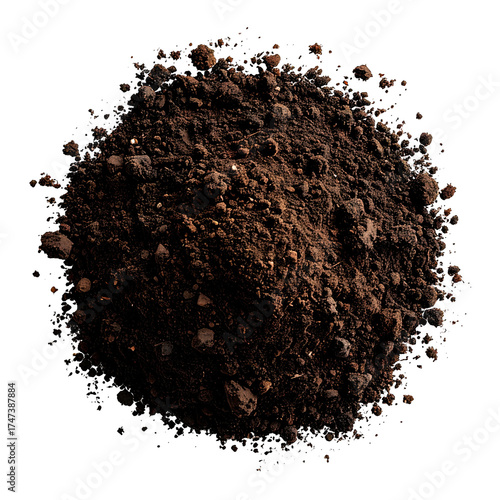 A close-up of a pile of dark brown soil with small rocks, against a black backdrop