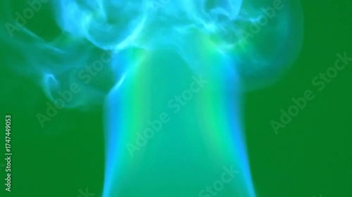 Abstract Green Smoke Plume with Blue and Yellow Accents on Green Chroma Key Background Ethereal Wisps of Light and Color