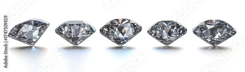 Five sparkling transparent diamonds arranged in a row on a white reflective surface showcasing various angled cuts and brilliant facets