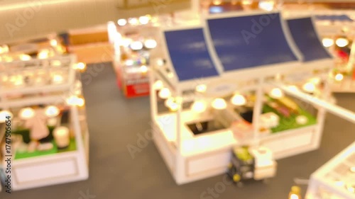 Blurred people' activities in food court.	