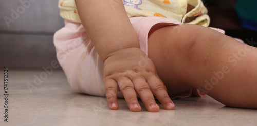 tiny hands and legs of toddler baby