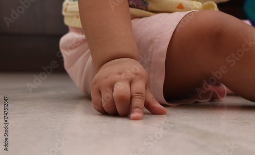 tiny hands and legs of toddler baby