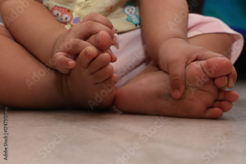 tiny hands and legs of toddler baby