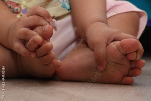 tiny hands and legs of toddler baby