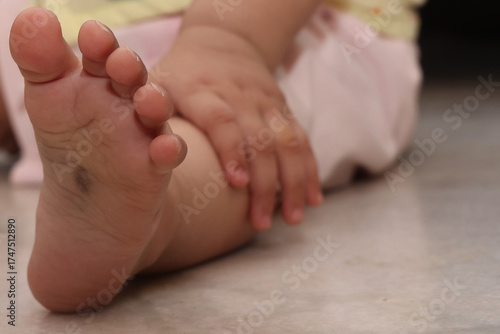 tiny hands and legs of toddler baby