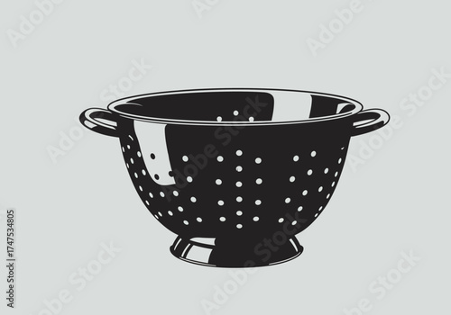 Black Colander with Circular Perforations for Kitchen Use.
