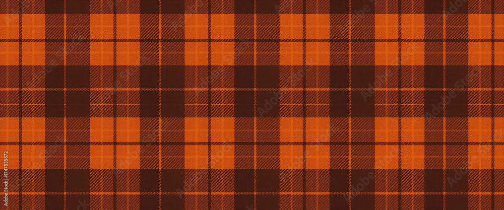 Obraz premium Seamless brown and orange plaid pattern in autumn tones cozy rustic fabric texture textile design