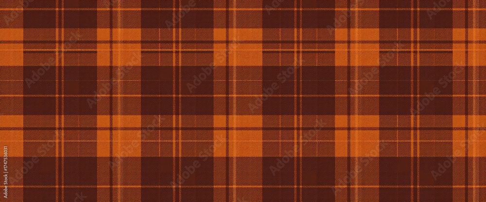 Obraz premium Seamless brown and orange plaid pattern in autumn tones cozy rustic fabric texture textile design