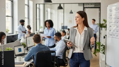 Woman Presenting Schedule on Whiteboard to Office Team