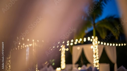 An abstract composition dominated by warm golden hues, with blurred highlights and a suggestion of lights in the periphery