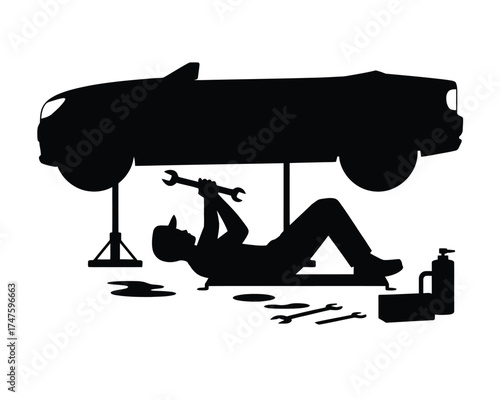 Black silhouette of mechanic working on car repair wrench