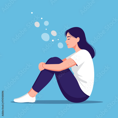 A young woman sits with her knees pulled to her chest exhaling a series of small bubbles representing her peaceful thoughts.