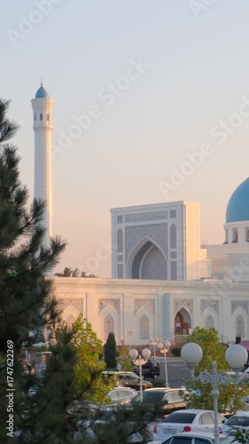 Minor Mosque in Tashkent illuminated by sunset light with blue domes