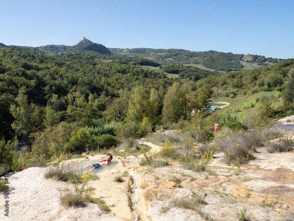 Obraz premium Parco naturale dei Mulini, public park with hot springs and dismantled system of grain mills at Bagno Vignoni, town in the province of Siena, Italy 